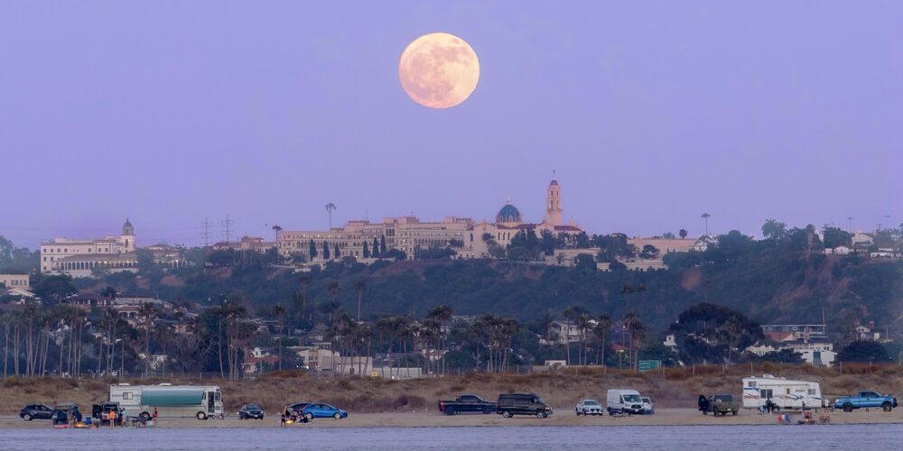 full moon over USD campus