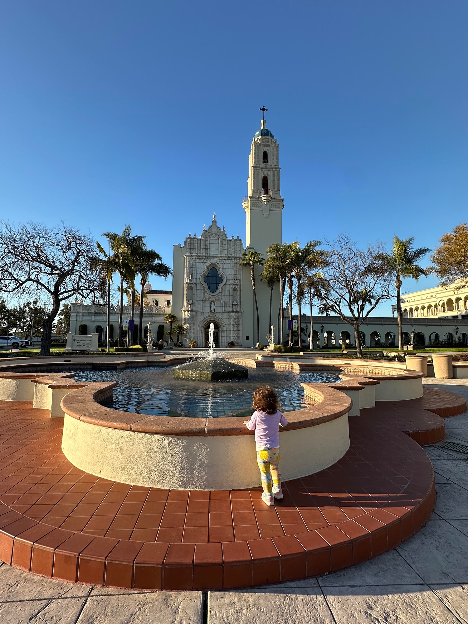 toddler at water fountain